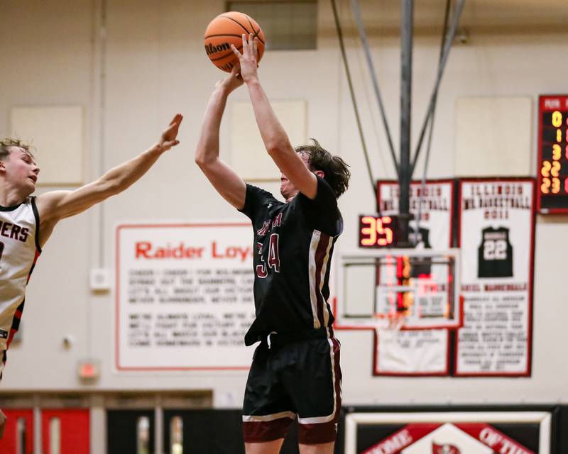 Plainfield North's Quintin Wiencek (34) shoots a jumper during their basketball game between Plainfield North at Bolingbrook, Friday Dec 13, 2024 in Bolingbrook.