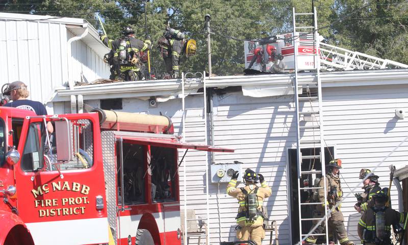 Firefighters work the scene of a fire at Grassers Heating and Plumbing on Wednesday, Sept. 17, 2025 in McNabb. The fire began shortly before 10a.m. A Mutual Aid Box Alarm System (MABAS) was elevated to the fourth-alarm. No one was injured in the fire. Fire departments from McNabb, Peru, Utica, Henry, Ladd, Hennepin, Granville, Oglesby, Spring Valley, Leonore, Troy Grove, Seatonville, Wenona, Standard, Lacon-Sparland, Bureau and Tonica all responded to the scene. Firefighters left the scene at 11:30a.m.