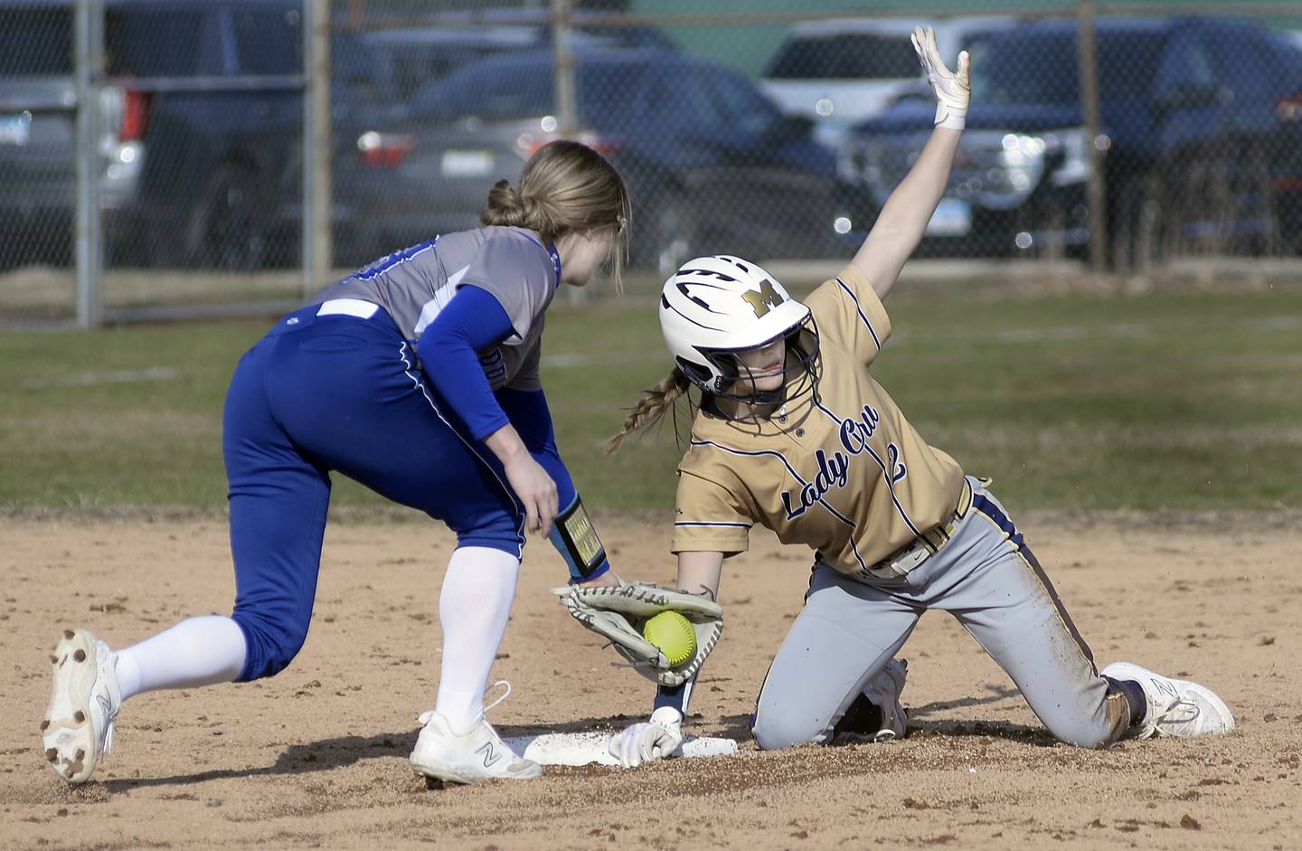 Marquette’s Lindsey Kaufmann avoids the tag by Princeton’s Malaya Hecht on a stolen base in the 2nd inning on Monday, March 27, 2023 at Marquette.