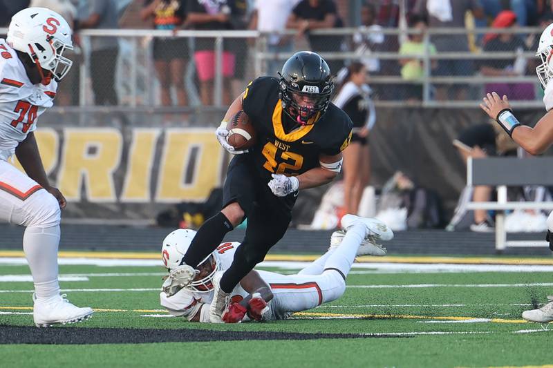 Joliet West’s Gavin Garcia rushes against Shepard on Friday, Aug. 25, 2023 in Joliet.