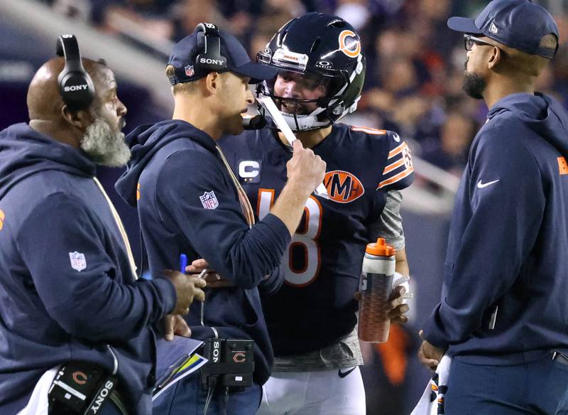 Chicago Bears head coach Ben Johnson talks to quarterback Caleb Williams during a timeout in their game against the Minnesota Vikings Monday, Sept. 8, 2025, at Soldier Field in Chicago.