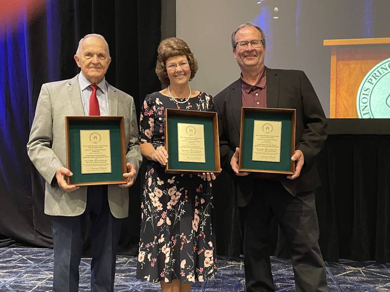 Lighted Way recently received The Reaching Out and Building Bridges Award at the Illinois Principals Association Conference in Peoria. Pictured are La Salle Alderman Jerry Reynolds (left), Lighted Way Executive Director Jessica Kreiser and Peru Mayor Ken Kolowski.