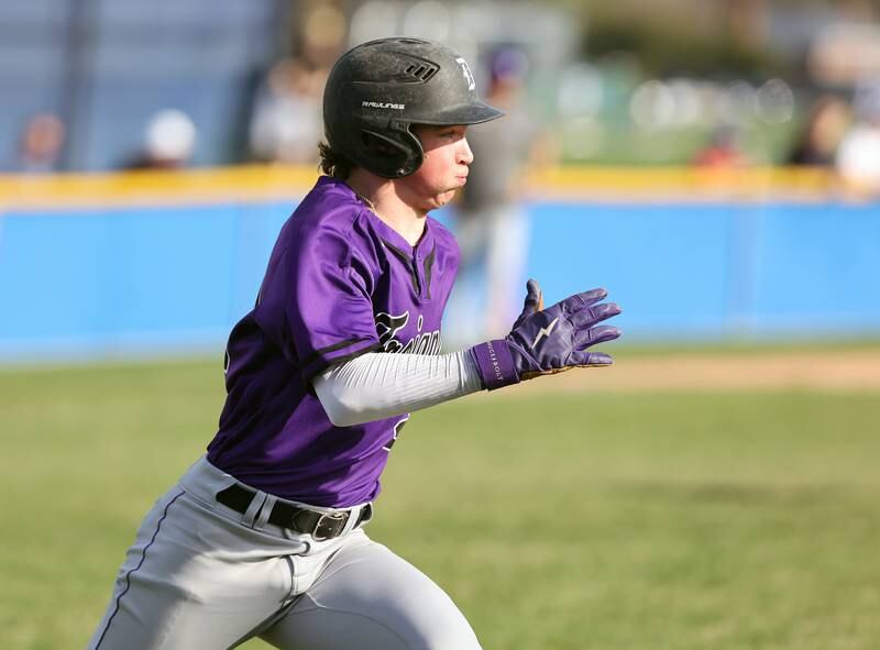 Downers Grove North's Ross Oros (29) runs to first during the boys varsity baseball game between Lyons Township and Downers Grove North high schools in Western Springs on Tuesday, April 11, 2023.