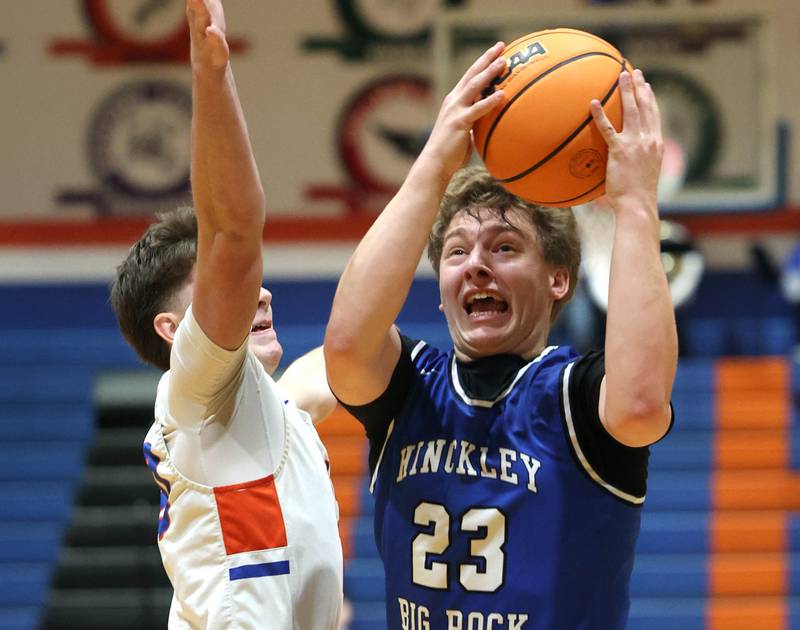 Hinckley-Big Rock's Luke Badal goes to the basket against Genoa-Kingston's Jaiden Lee Tuesday, Jan. 6, 2026, during their game at Genoa-Kingston High School.