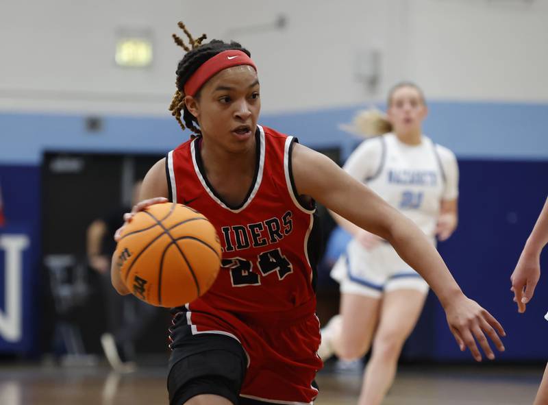 Bolingbrook's A'mya Simmons (24) handles the ball during the girls varsity basketball game between Bolingbrook high school and Nazareth Academy on Monday, Jan. 12, 2026 in La Grange Park.