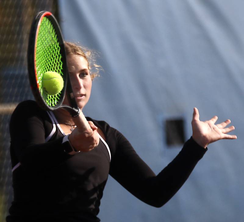 Prairie Ridge’s Charlie Benton returns the ball Thursday, Oct. 23, 2025, during the first day of the IHSA State Girls Tennis Tournament at Schaumburg High School.