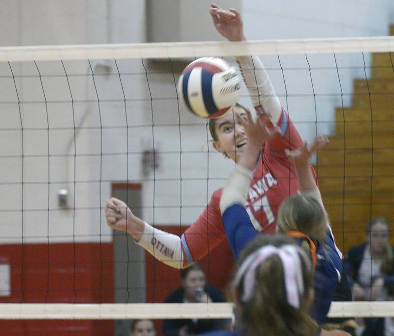 Ottawa’s Olivia Evola gets this spike past Pontiac during the first match Tuesday at Streator.