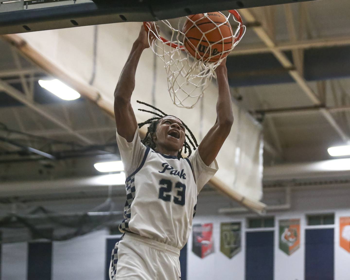 Oswego East's Mason Lockett (23) dunks during their basketball game between Yorkville at Oswego East. Friday, Dec 19, 2025 in Oswego.