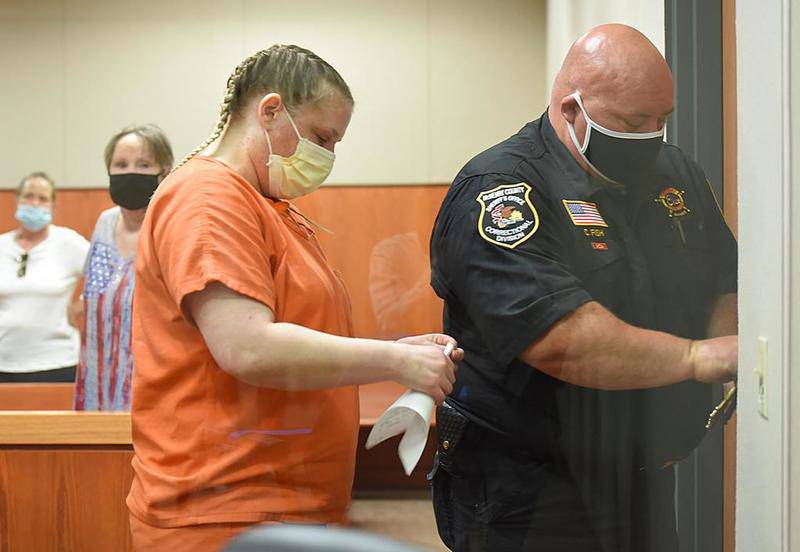 JoAnn Cunningham, 37, leaves a McHenry County courtroom Friday after receiving a 35-year sentence for killing her 5-year-old son, AJ Freund, in April 2019 at their Crystal Lake home.