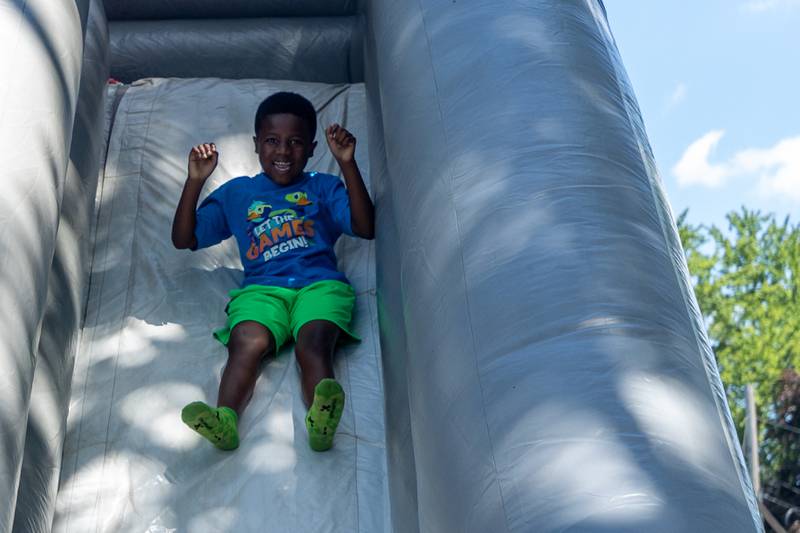 Weston slides down slide at the Touch a Truck event on Saturday, June 28, 2025 at Centennial Park in Peru.