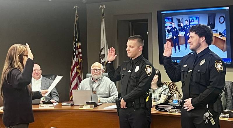 Sterling City Clerk Teri Sathoff swears in new Sterling Police Department officers Kolten Smith and Brandon Jagitsch during a City Council meeting on Jan. 6, 2025.