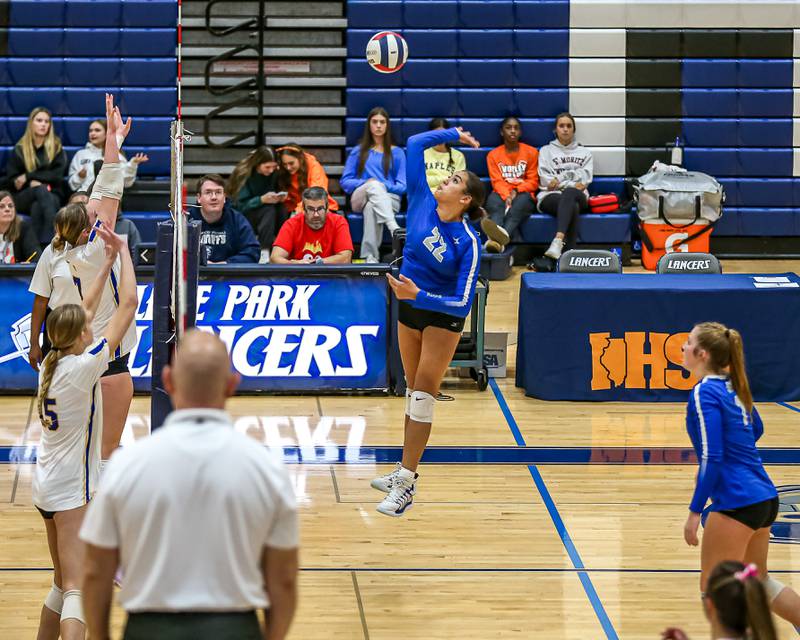 St. Charles North's Sidney Wright (22) spikes the ball during Class 4A Lake Park Regional final volleyball match between Wheaton North at St Charles North.  Oct 31, 2024  in Roselle.