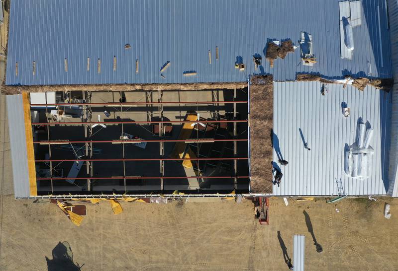 Crews from Vitale Construction work on replacing the roof of the exterior of the Exhibit Hall's 1 and 2 building on Wednesday, Nov. 8, 2023 at the Bureau County Fairgrounds in Princeton.