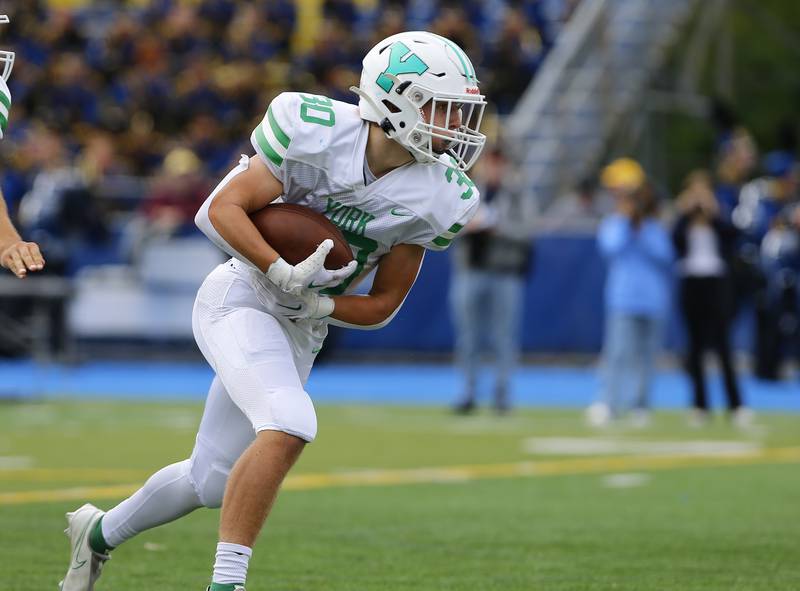 York's Jake Melion (30) carries the ball during the boys varsity football game between York and Lyons Township on Saturday, Sept. 24, 2022 in Western Springs.