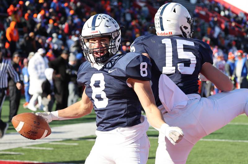 Cary-Grove's Andrew Prio celebrates after his receiving touchdown with teammate Jake Hornok Saturday, Nov. 25, 2023, during their IHSA Class 6A state championship game against East St. Louis in Hancock Stadium at Illinois State University in Normal.