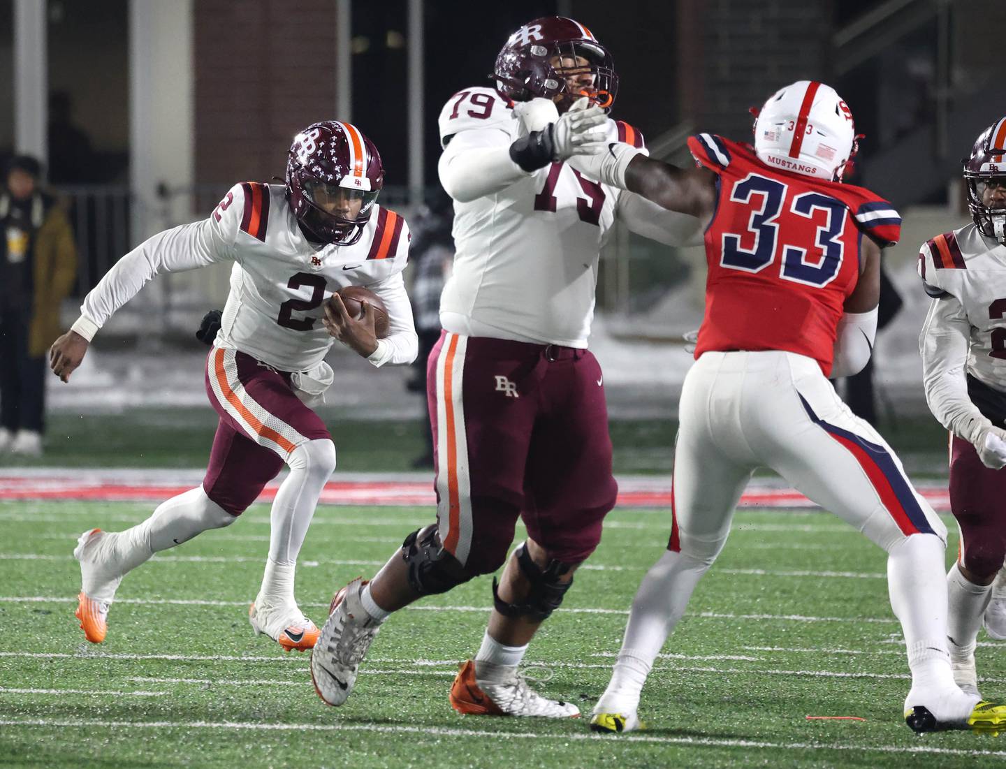 Brother Rice's C.J. Gray follows teammate Ethan Posey through the St. Rita defensive line Wednesday, Dec. 3, 2025, during their IHSA Class 7A state chamionship game in Huskie Stadium at Northern Illinois University in DeKalb.