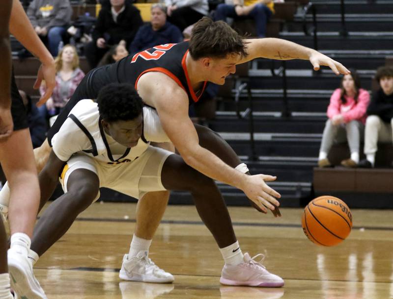 Jacobs' Samson Averehi battles with McHenry's Conner McLean for a loose ball during a Fox Valley Conference basketball game on Friday, Jan. 24, 2025, at Jacobs' High School.