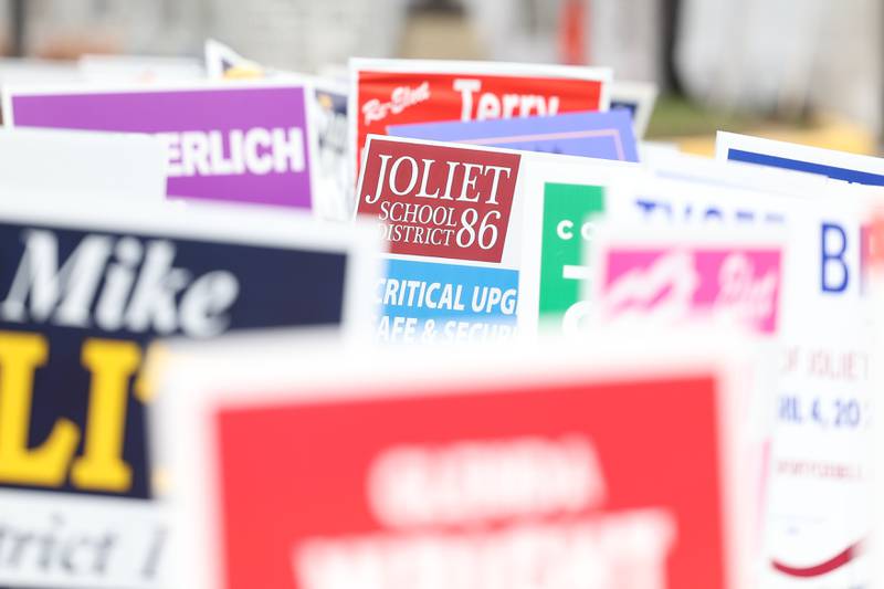 Joliet School District 86 sign sit among numerous campaign signs along the parking lot at the Will County Office Building, in Joliet. Will County Office Building was one of multiple locations open for early voting on Monday, April 3, 2023 in Joliet.