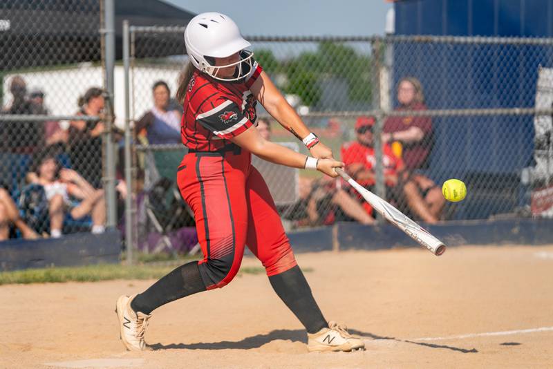 Yorkville's Sara Ebner (14) hits a two run double against Wheaton Warrenville South during the Class 4A Oswego softball sectional final game between Yorkville and Wheaton Warrenville South at Oswego High School on Friday, June 2, 2023.