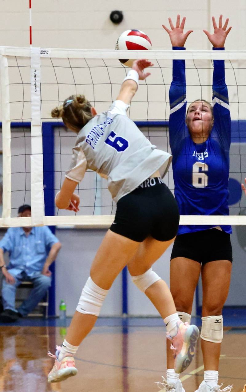 Princeton's Caroline Keutzer hits against Newman's Brooklyn Smith in Tuesday's Three Rivers match at Prouty Gym. The Tigresses won 2-0.