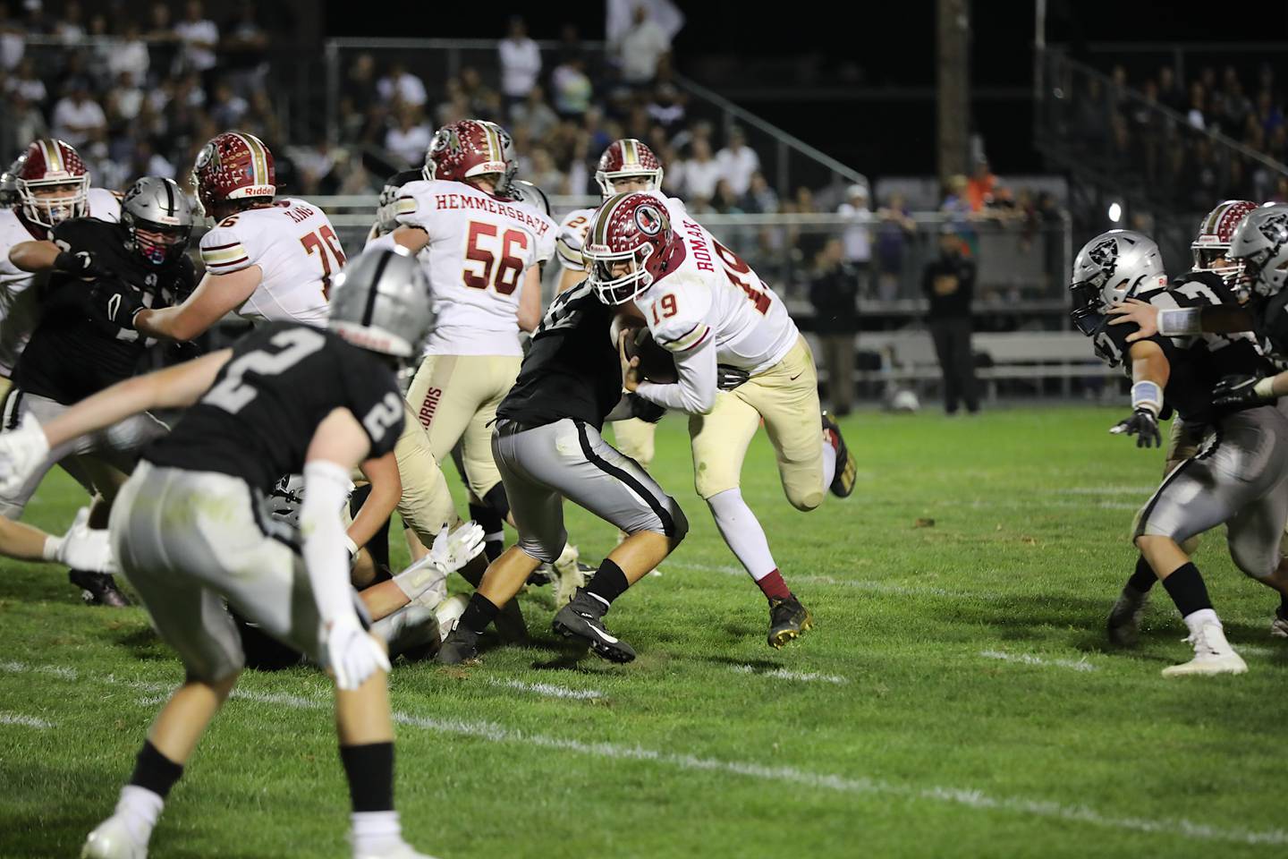 Morris quarterback Zach Romak runs Friday during a 49-35 win over Kaneland. Romak ran for 192 yards and three touchdowns and passed for 123 yards.