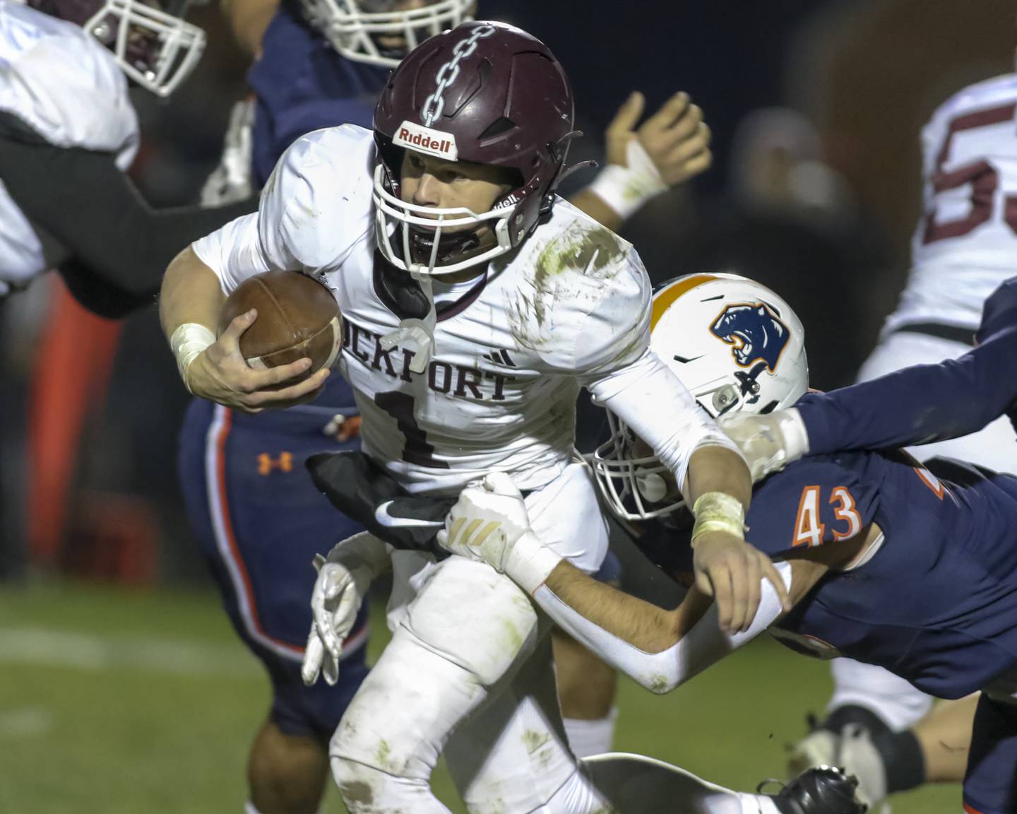 Lockport's Brendan Mecher (1) runs a keeper up the middle during Class 8A semifinal football game between Lockport at Oswego. Saturday, Nov 22, 2025 in Oswego.