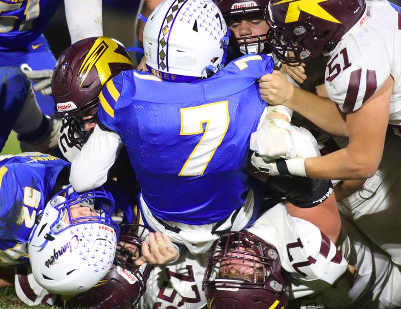 Aurora Central Catholic’s quarterback Grant Bohr is brought down in IHSA football Class 3A second-round playoff action at Bob Stewart Field on the campus of Aurora Central Catholic High School in Aurora on Friday, November 7, 2025.