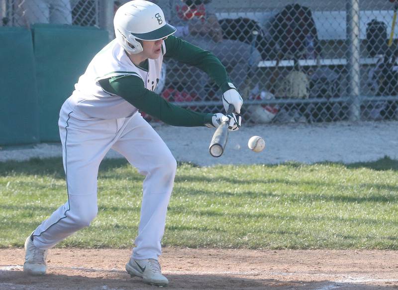 St. Bede's Carson Riva lays down a bunt against Ottawa on Wednesday, March 20, 2024 at St. Bede Academy.