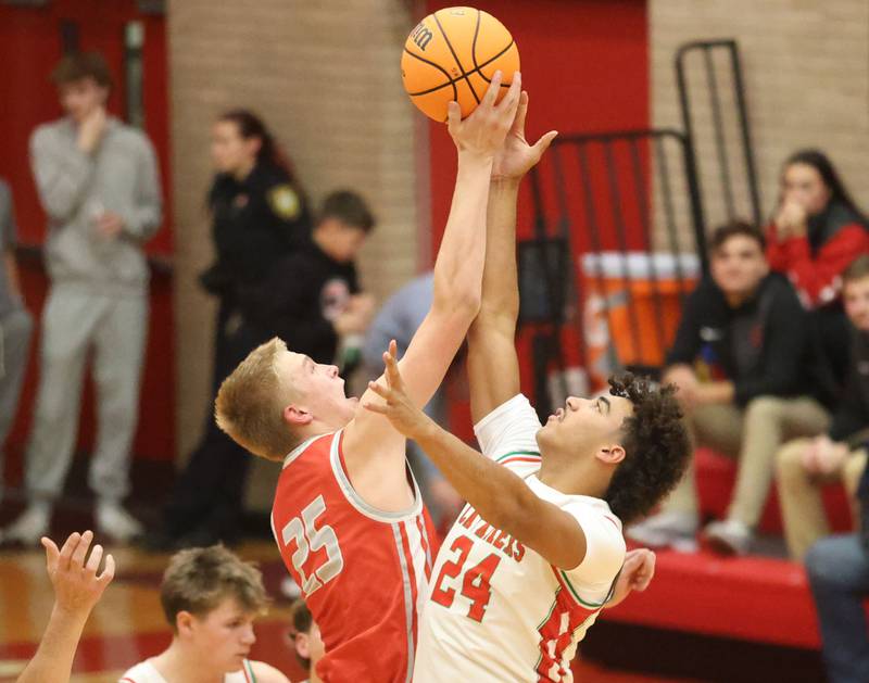 Streator's Joseph Hoekstra wins the opening tip over L-P's Marion Persich during the Dean Riley Shootin' The Rock Thanksgiving Tournament on Monday Nov. 24, 2025 in Kingman Gymnasium at Ottawa High School.