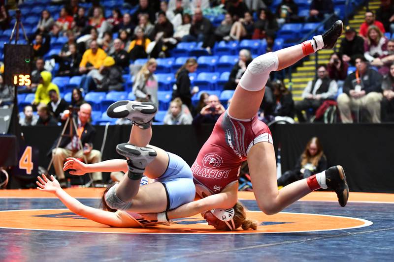 Claudia Heeney of Lockport Township, right, and Viola Pianetto of Mt. Prospect wrestle in the 135-pound championship match in the IHSA Girls Individual State Finals on Saturday, March 1. Heeney took first place over Pianetto.