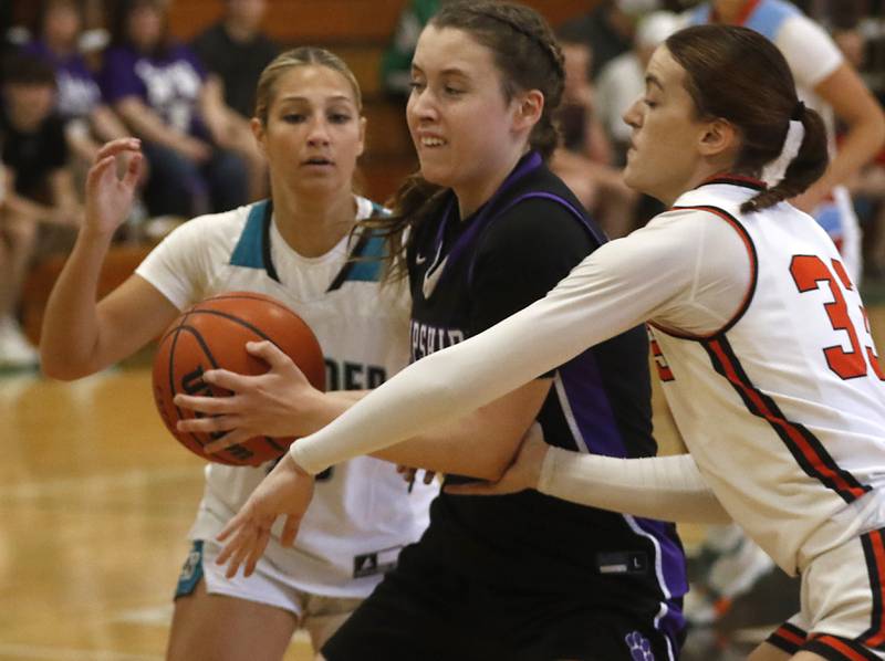 Hampshire's Whitney Thompson is double teamed by Woodstock North's Addison Rishling and Crystal Lake Central's Kathryn Hamill during the girl’s game of McHenry County Area All-Star Basketball Extravaganza on Sunday, April 14, 2024, at Alden-Hebron’s Tigard Gymnasium in Hebron.