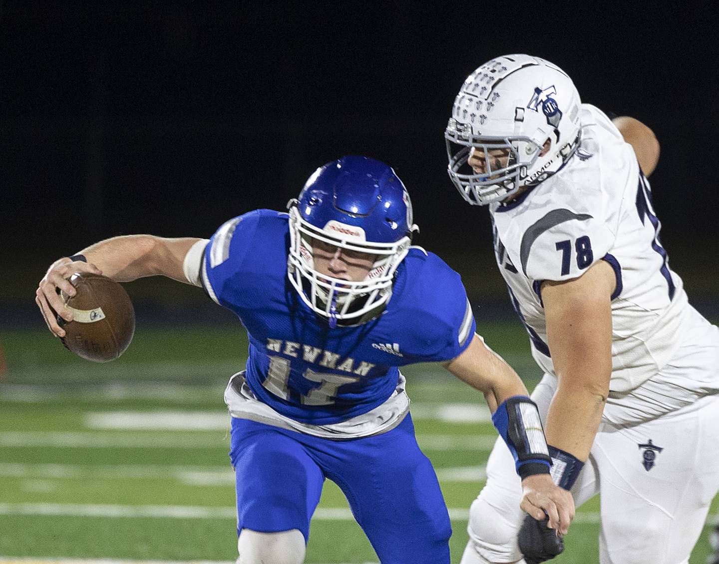 Newman’s George Jungerman looks to get away from Monmouth-Roseville’s Landyn Angelo Friday, Oct. 25, 2024, at Roscoe Eades Stadium in Sterling.