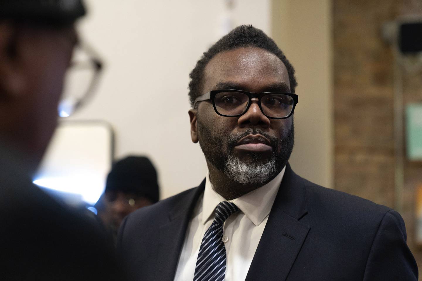 Chicago mayoral candidate Brandon Johnson speaks to supporters during a public listening session at Principle Barbers, Monday, Dec. 19, 2022, in the North Lawndale neighborhood of Chicago. (AP Photo/Erin Hooley)