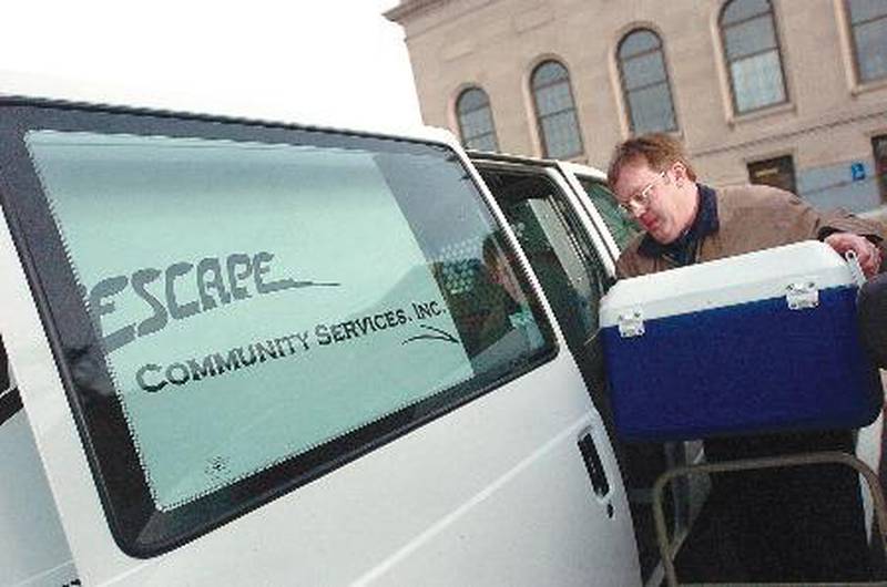 Len Rice loads up a Lifescape van with food items. Nationally, Meals on Wheels is drastically lacking volunteer drivers for the program.