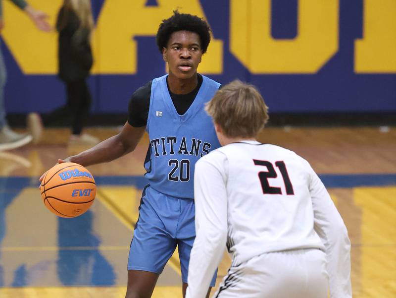 IMSA’s Mofe Suleiman brings the ball up against Indian Creek's Parker Murray Friday, Feb. 6, 2026, during their Little 10 Conference championship game at Somonauk High School.