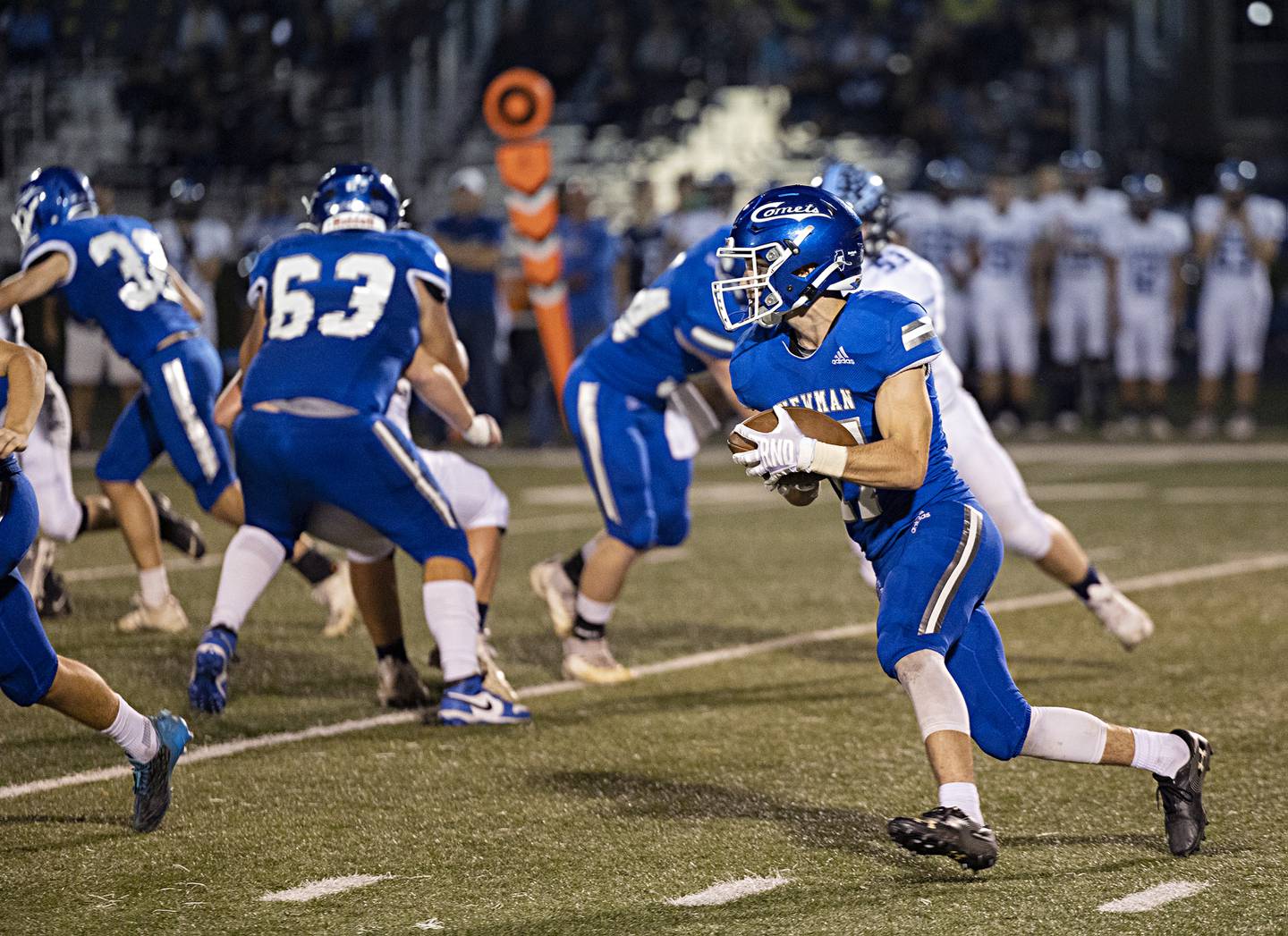 Newman’s Carter Rude hits the hole against Bureau Valley Friday, Sept. 29, 2023 in Sterling.