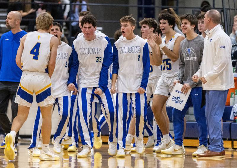 The  Wheaton North bench celebrates during a timeout during a game against Wheaton Warrenville South on Friday, Dec. 20, 2024.