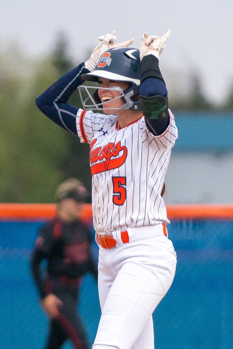 Oswego’s Marissa Moffett (5) reacts after driving in a run against Yorkville during a softball game at Oswego High School on Tuesday, April 25, 2023.