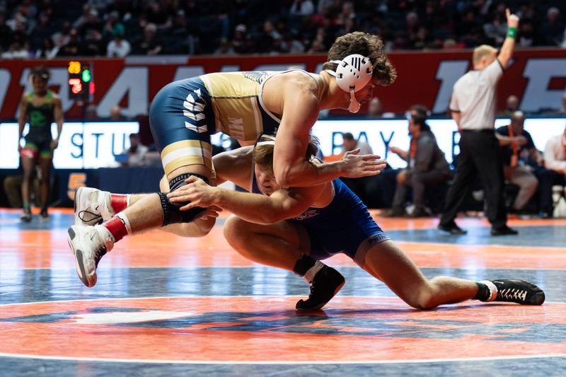 Princeton junior Case Etheridge (bottom) takes a shot during the IHSA Class 1A state tournament on Saturday, Feb. 22, 2025 in Champaign. Etheridge placed fourth at 165 pounds.