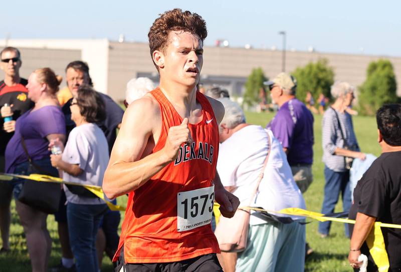 DeKalb's Riley Newport crosses the finish line in first place Tuesday, Aug. 30, 2022, during the Sycamore Cross Country Invitational at Kishwaukee College in Malta.