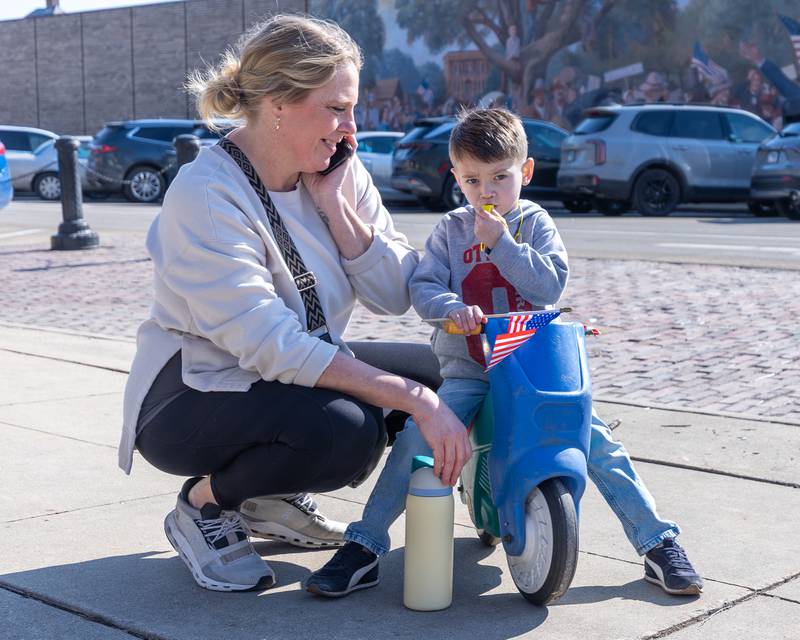 Child blows whistle at the 'Pretti good time for a Protest' on Feb. 15, 2026 at Washington Square Park in Ottawa.
