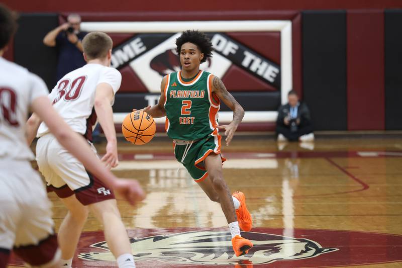 Plainfield East’s Camren Smith works the ball against Plainfield North on Tuesday, Dec. 9, 2025 in Plainfield.