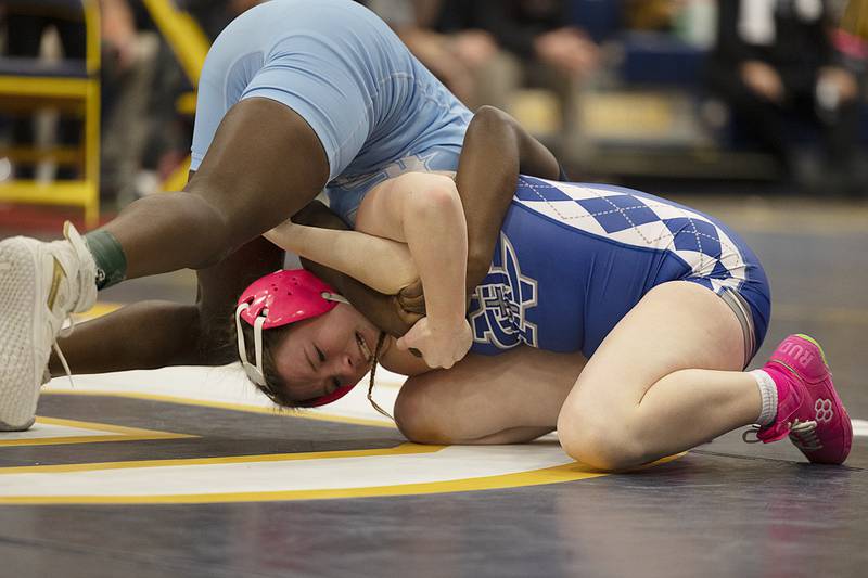 Allison Asante of Plainfield South works against Newman’s Kaylee Benyo in the 120 pound finals Saturday, Dec. 7, 2024, at the Carson DeJarnatt Invitational. Asante took the win.