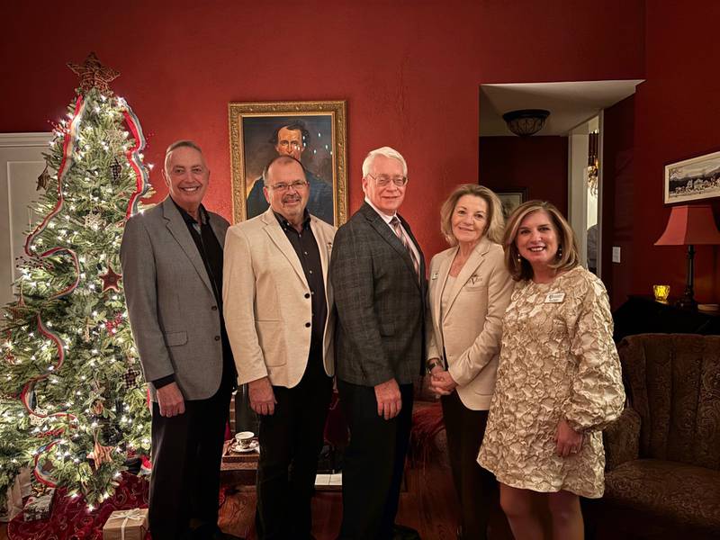 Current and former board chairs of the Starved Rock Country Community Foundation gathered Dec. 11, 2024, at the historic Gen. Wallace Home of Jay and Kim McCracken of Ottawa. Pictured are Jay McCracken, left, Bob Eschbach, Reed Wilson, co-founder Pamela Beckett, and current chair Tracy Bedeker. Former chair Tom Justice was unavailable. The Foundation is celebrating its 10th anniversary this fall.
