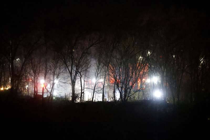Firefighters battle a blaze along the railroad tracks just north of Kimball Street Wednesday, Dec. 4, 2024, in Elgin.