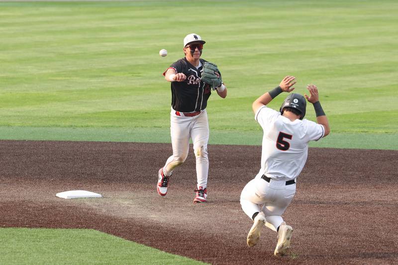 Bradley-Bourbonnais’ Kason Bynum attempts a double play during the Boilermakers’ 2-0 loss to Normal Community in the IHSA Class 4A Illinois Wesleyan University Sectional semifinal on Thursday, June 5, 2025.