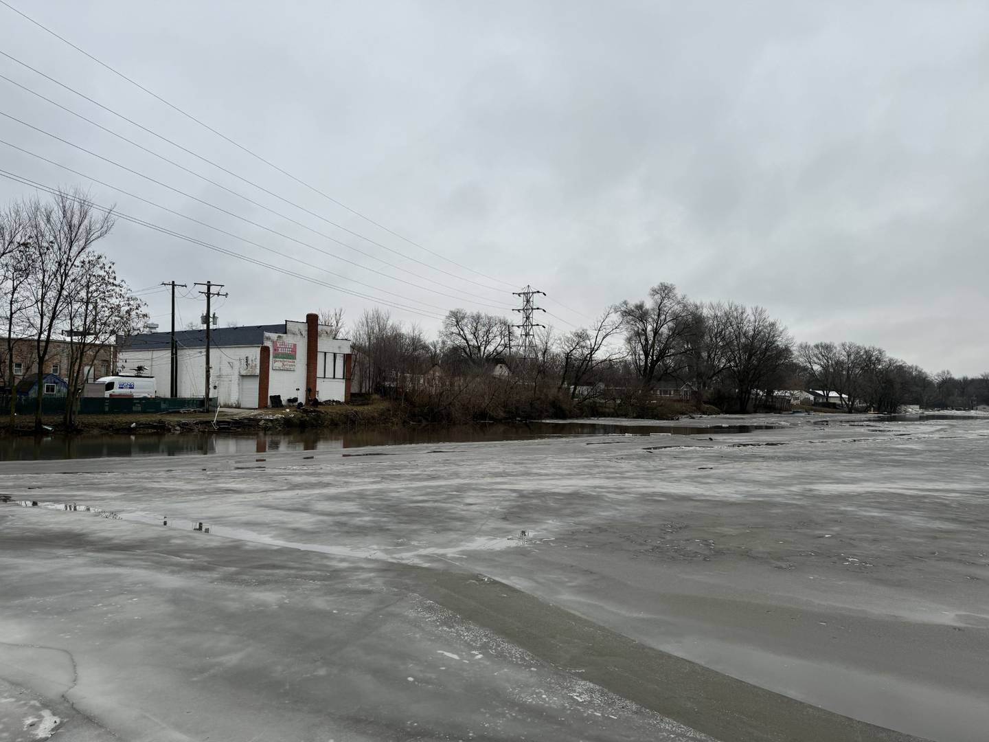 The parking lot and area behind Old School Brewing on Route 53 in Wilmington is flooded over as ice jams causing flooding along the Kankakee River on Jan. 26, 2024.