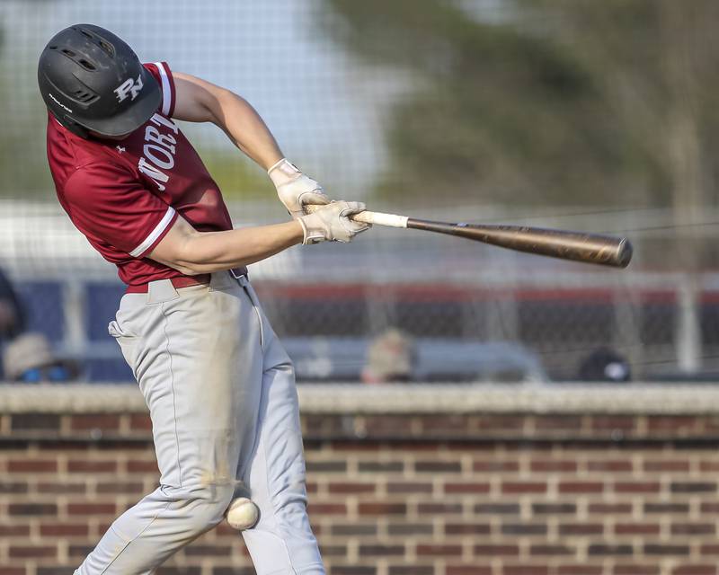 Plainfield North's Gavin Person (7) fouls a ball off his knee during baseball game between Plainfield North at Oswego, Thursday, April 24, 2025 in Oswego.
