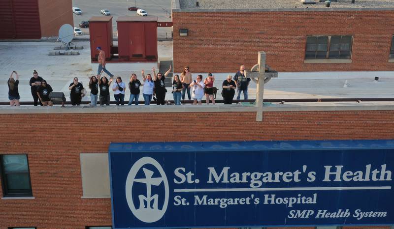 St. Margaret's employees gather on the rooftop of St. Margarets's Hospital for a gathering on Friday, June 16, 2023 in Spring Valley.