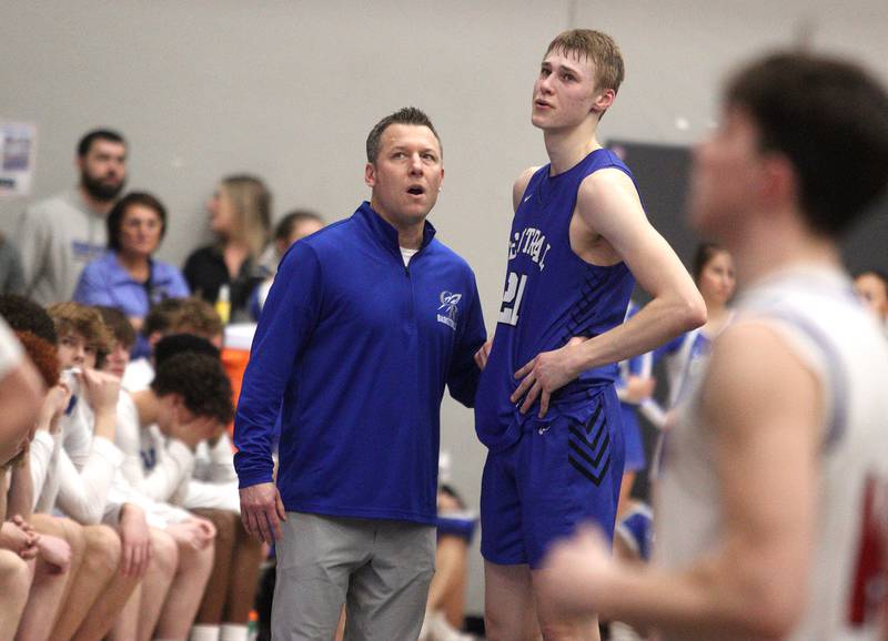 Burlington Central Head Coach Brett Porto chats with Drew Scharnowski late in a loss to Marmion Academy in IHSA Class 3A Sectional title game action at Burlington Central High School Friday night.